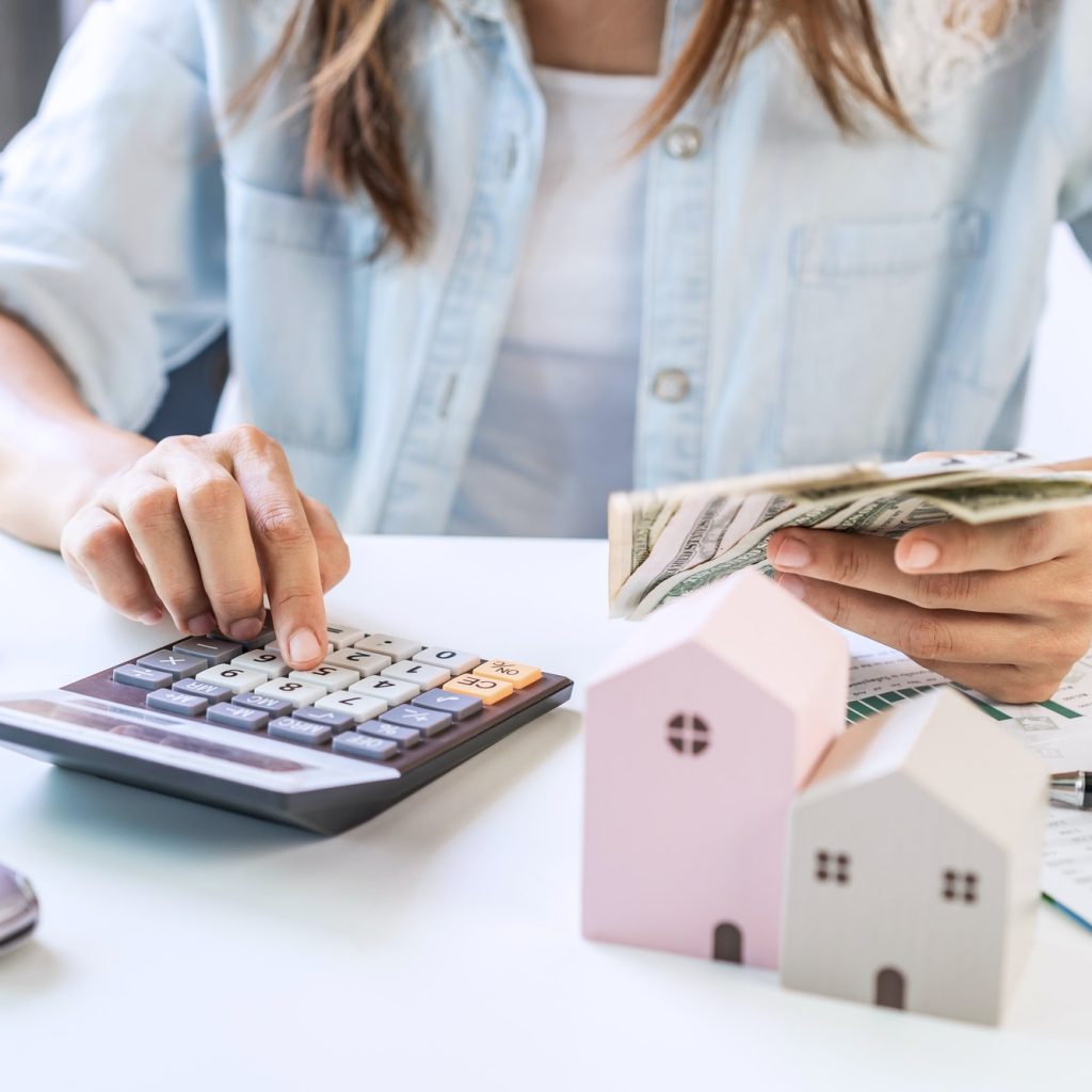 Stressed young woman calculating monthly home expenses and Car installment